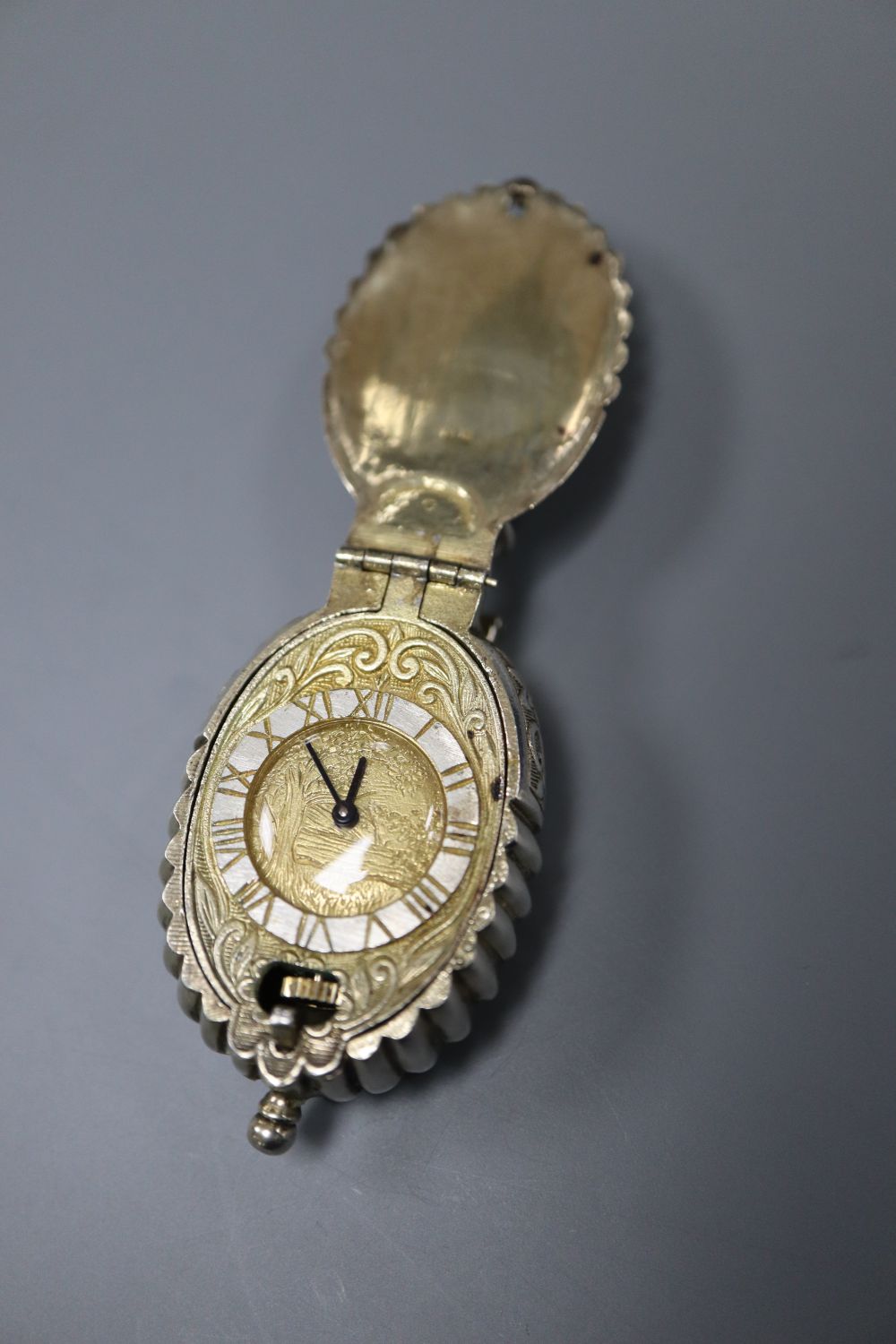 A modern limited edition St. Jamess House Company parcel gilt silver pendant watch, of shell form,